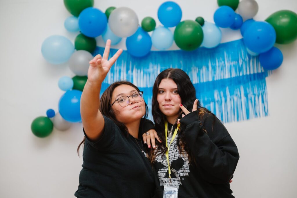 Two high school volunteers at a Center event