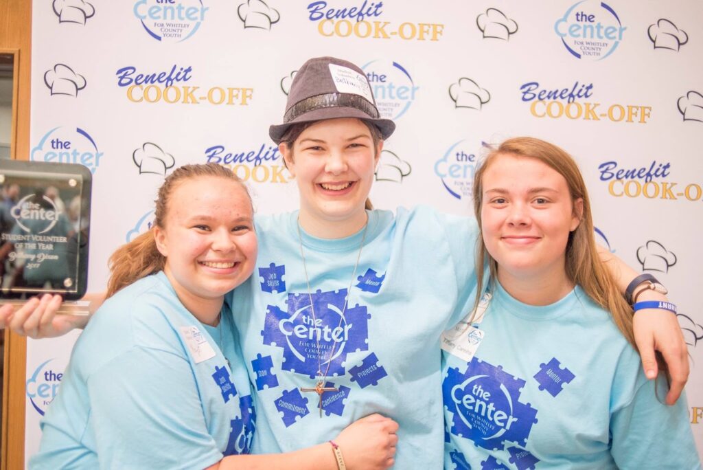 Three students at the Benefit Cook-Off