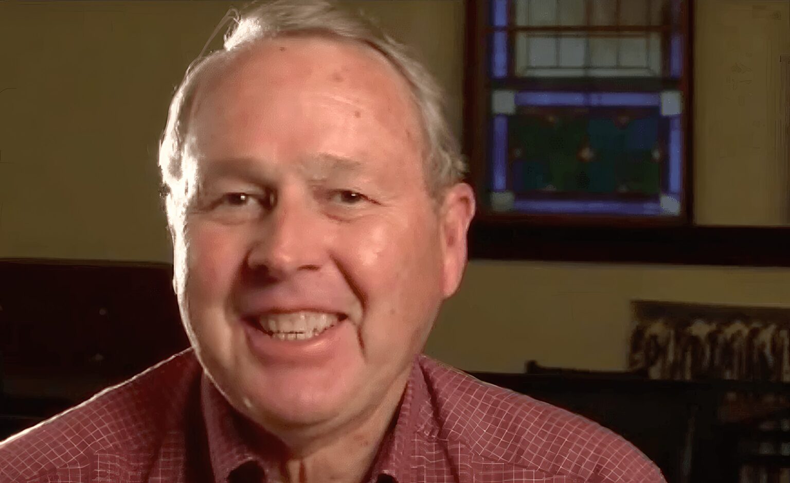 Jerry Walker smiling during a video interview